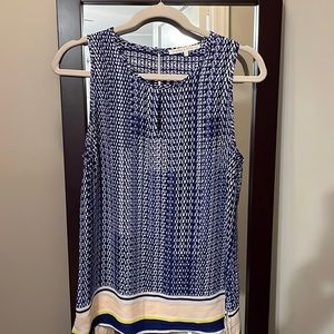 Light weight, polyester, sleeveless tank.